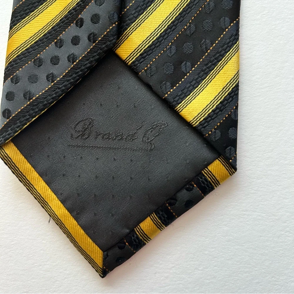Striped black and gold men's dressy tie